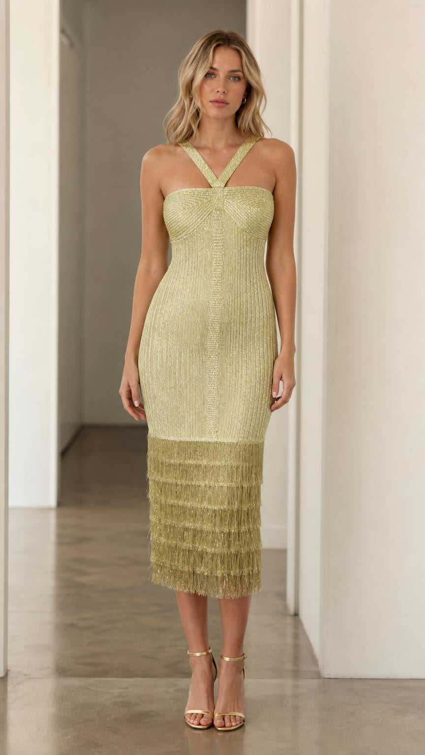 Model wearing olive green halter fringe midi dress, front view