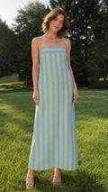 Front view of woman wearing blue striped maxi dress