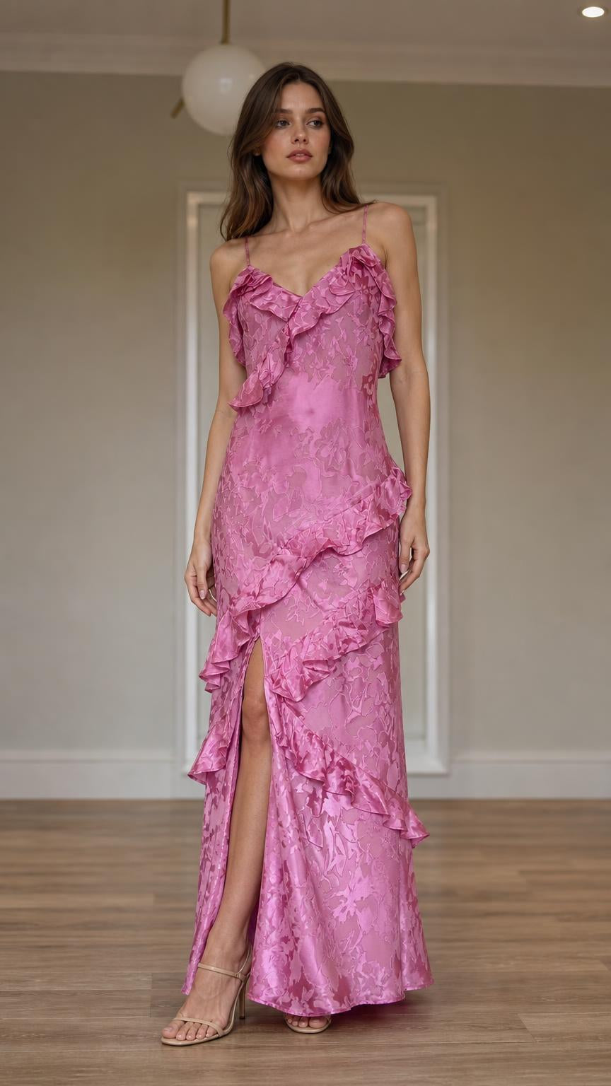 Front view of model wearing pink ruffled slip maxi dress with slit