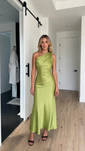 Front view of model wearing green one-shoulder satin maxi dress
