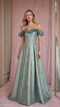 Front view of model wearing sage green off-shoulder brocade evening gown