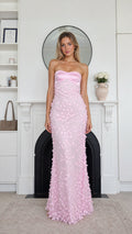 Front view of model wearing pink strapless floral applique maxi dress
