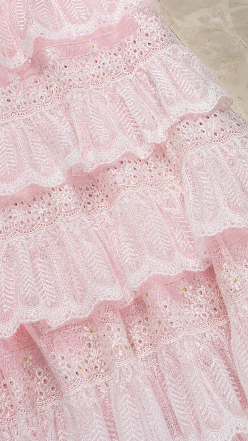 Close up texture view of pink tiered lace fabric