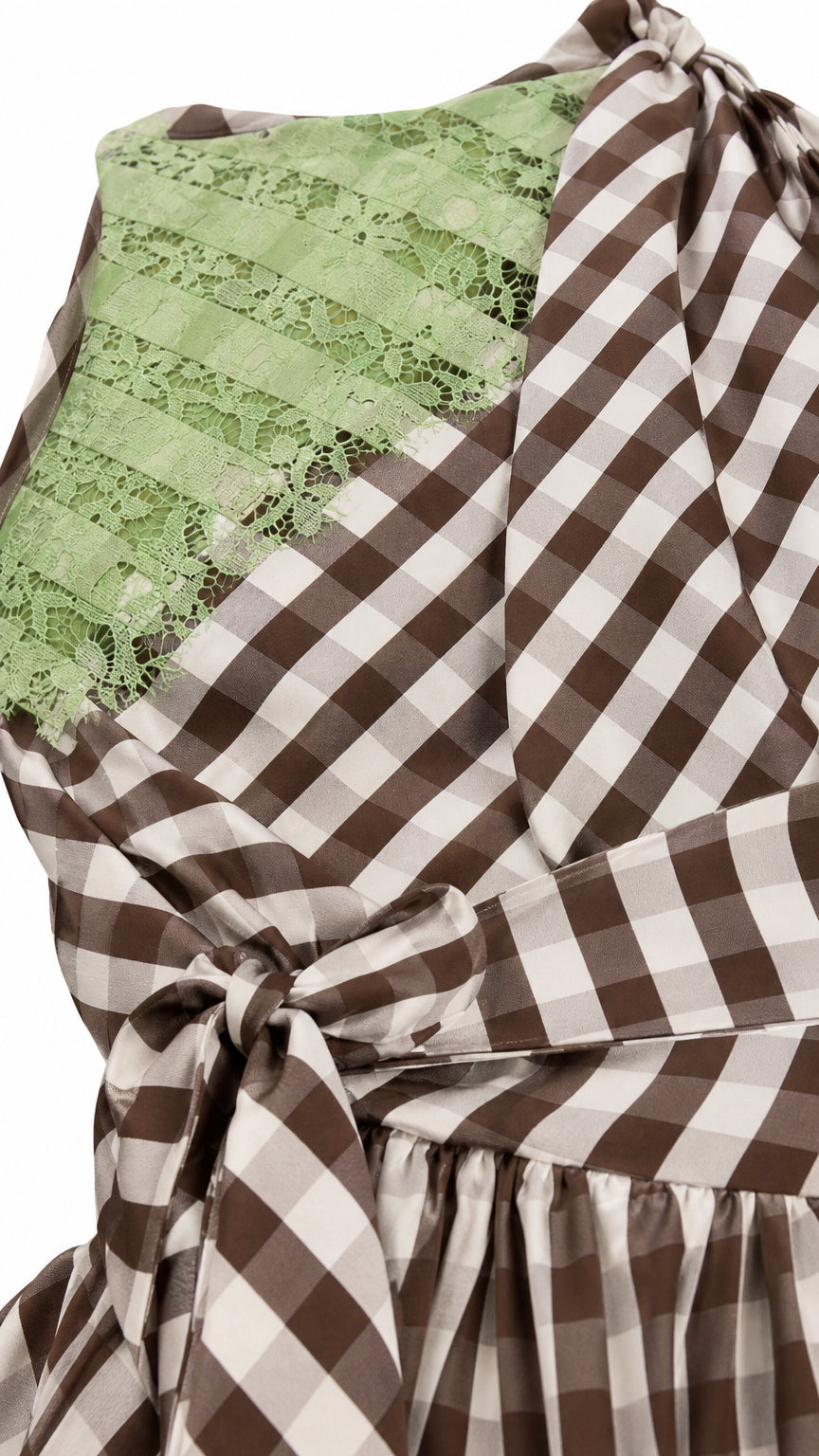 Close up of shoulder lace panel and gingham pattern